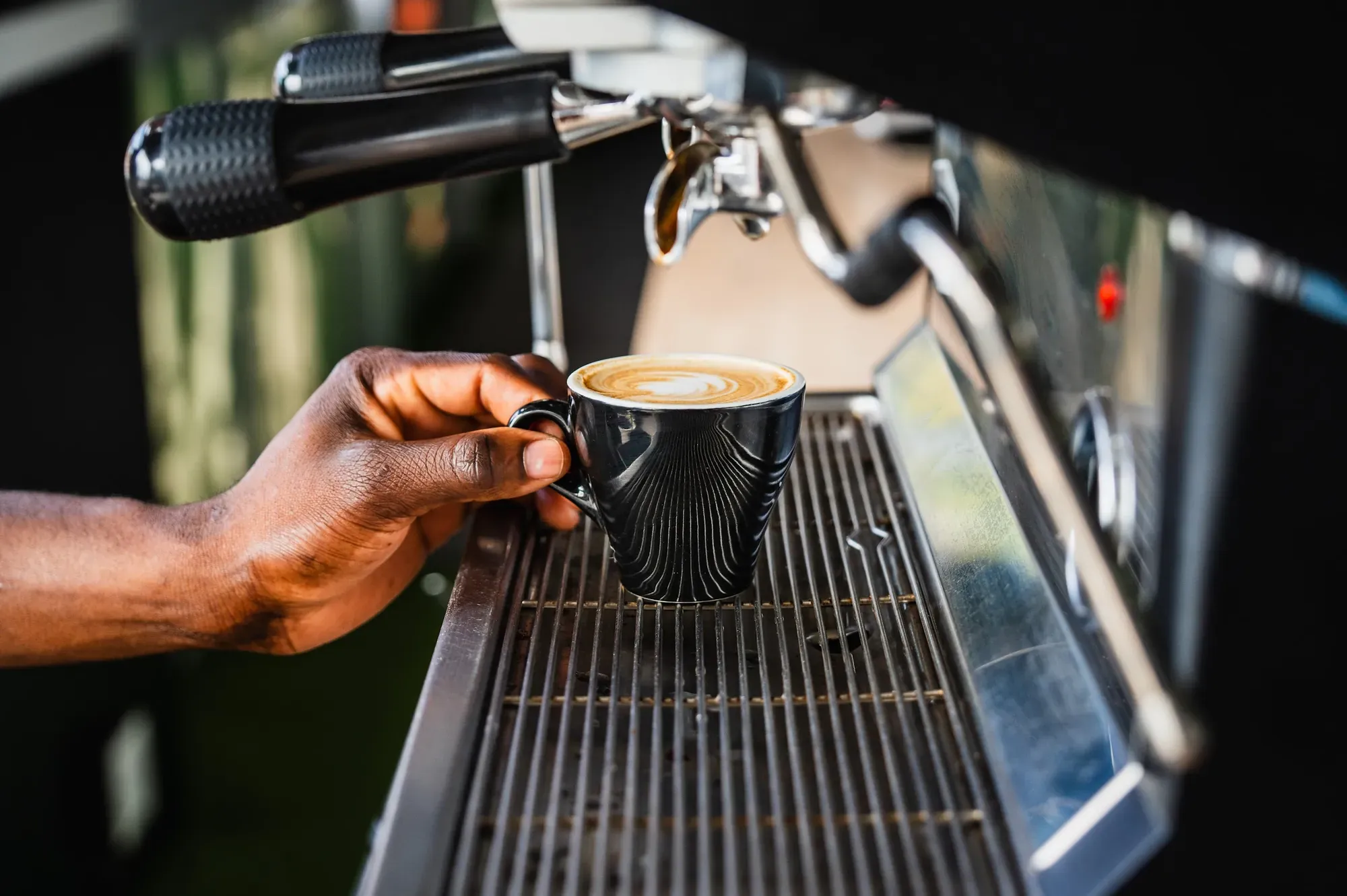 Barista pulling an espresso at the on-site café