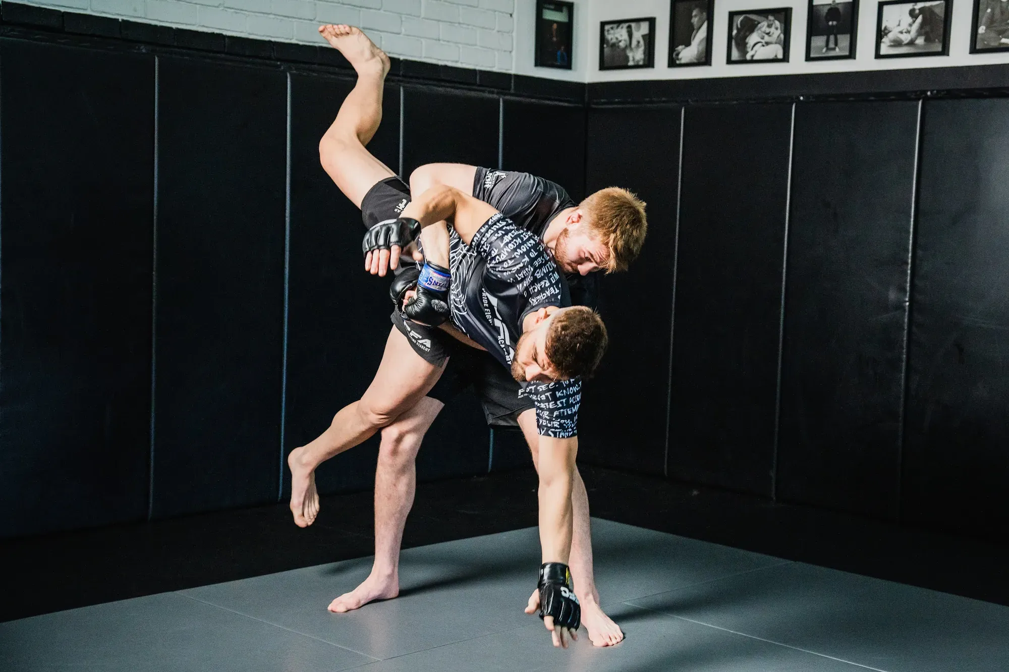 Wrestler lifting an opponent for a takedown